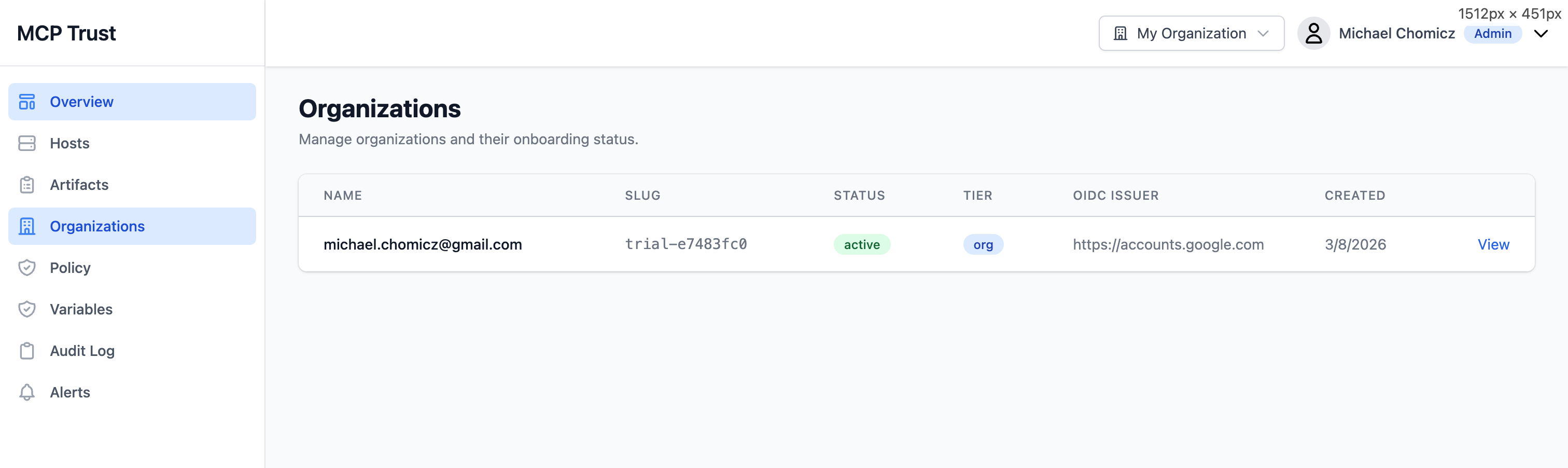 Organizations page showing multi-org table with name, slug, status, tier, OIDC issuer, and created date columns